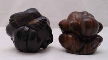 A pair of hardwood oriental hand carved crouching Buddhas, 10cm (h)