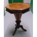 A Victorian mahogany octagonal trumpet form sewing box the hinged cover revealing fitted interior