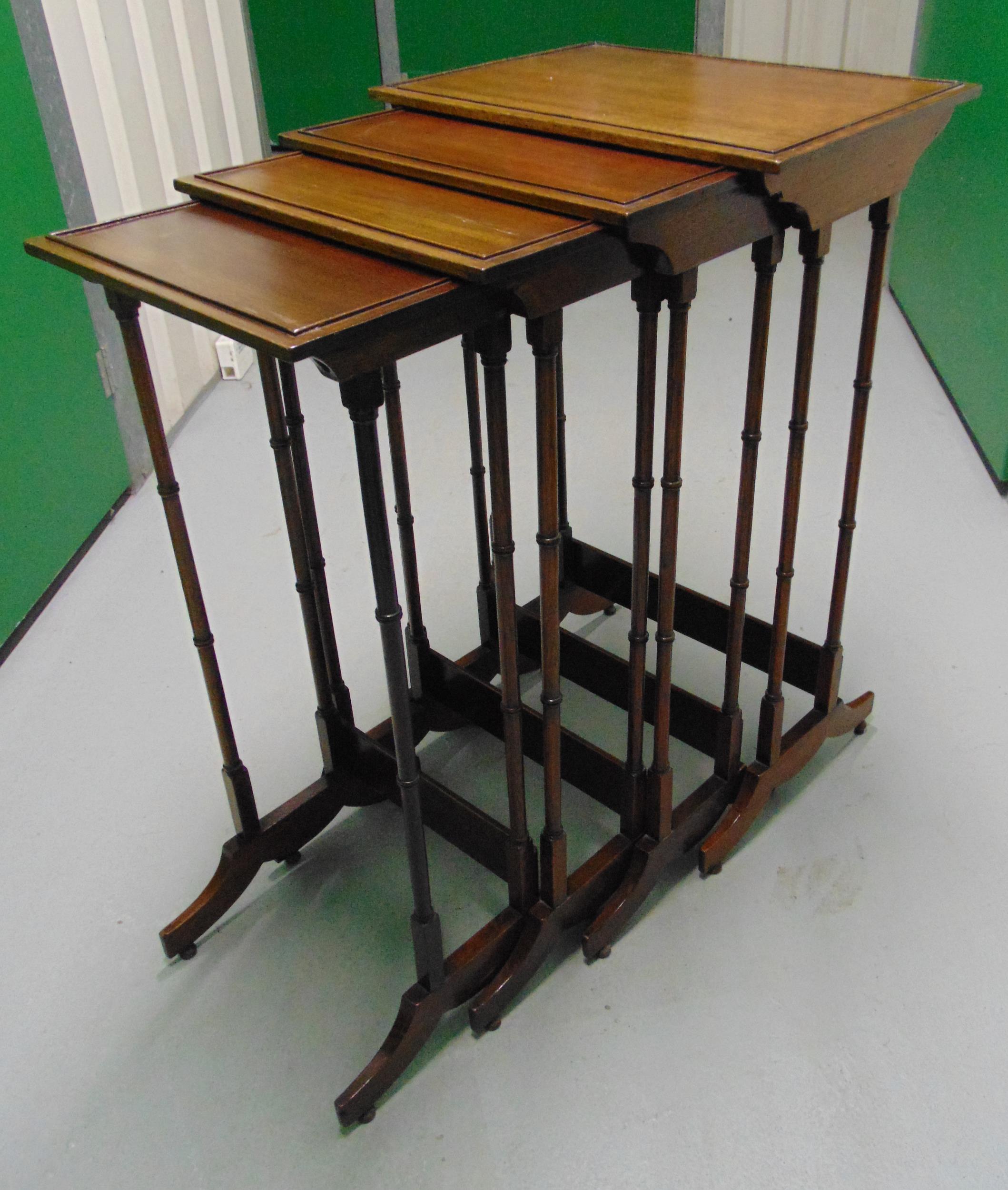 An Edwardian rectangular mahogany nest of four tables with faux bamboo supports, tallest 76 x 46 x