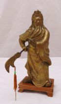 A Chinese bronze figurine of Warrior God Guan Gong Yu holding a weapon, mounted on a rectangular