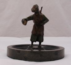 A cold painted Austrian bronze figurine of an Arabian gentleman selling sharbat on a circular marble