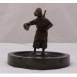 A cold painted Austrian bronze figurine of an Arabian gentleman selling sharbat on a circular marble