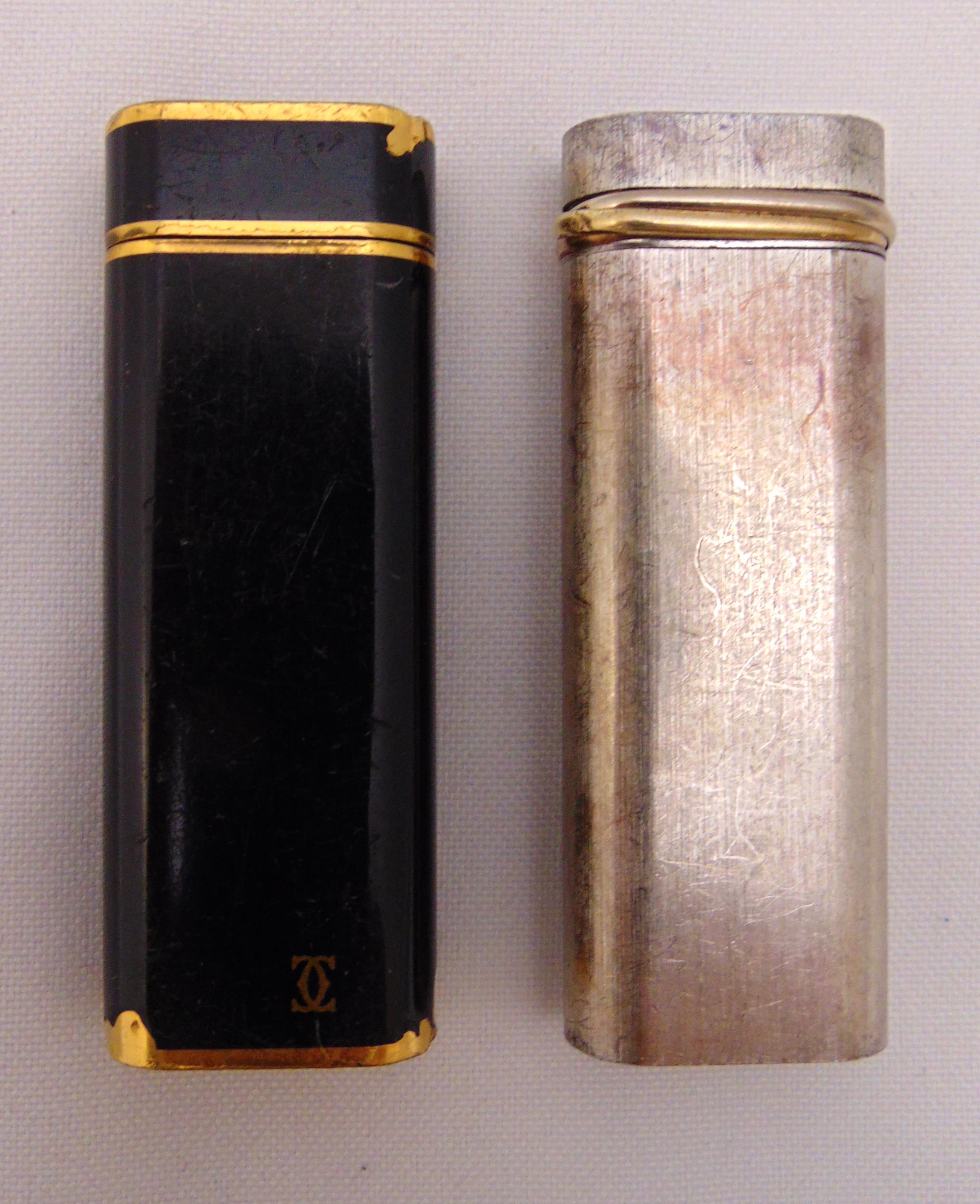 Two Cartier of Paris cigarette lighters signed to the bases