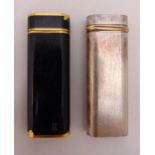 Two Cartier of Paris cigarette lighters signed to the bases