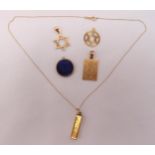 A quantity of 9ct gold to include five pendants and 14ct gold chain, approx total weight 9.1g