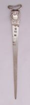 A white metal meat skewer with shell chased terminal and pierced handle, 31cm (h)