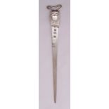 A white metal meat skewer with shell chased terminal and pierced handle, 31cm (h)