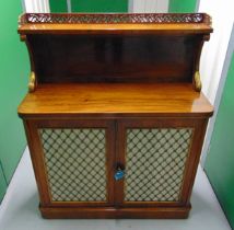 A 19th century rectangular mahogany chiffonier with an upper tier shelf above two cupboard doors