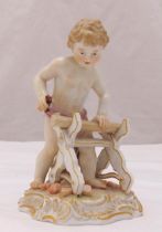 A Meissen figurine of a boy with a saw cutting a piece of wood, marks to the base, A/F, 14cm (h)