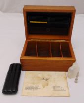 Davidoff humidor of customary form, rectangular with hinged cover to include a leather travel