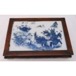 A Republic period rectangular blue and white ceramic plaque depicting figures in a landscape mounted