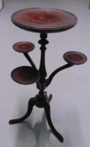 An early 20th century circular tea table with three side arms on three outswept legs, 60.5 x 36 x