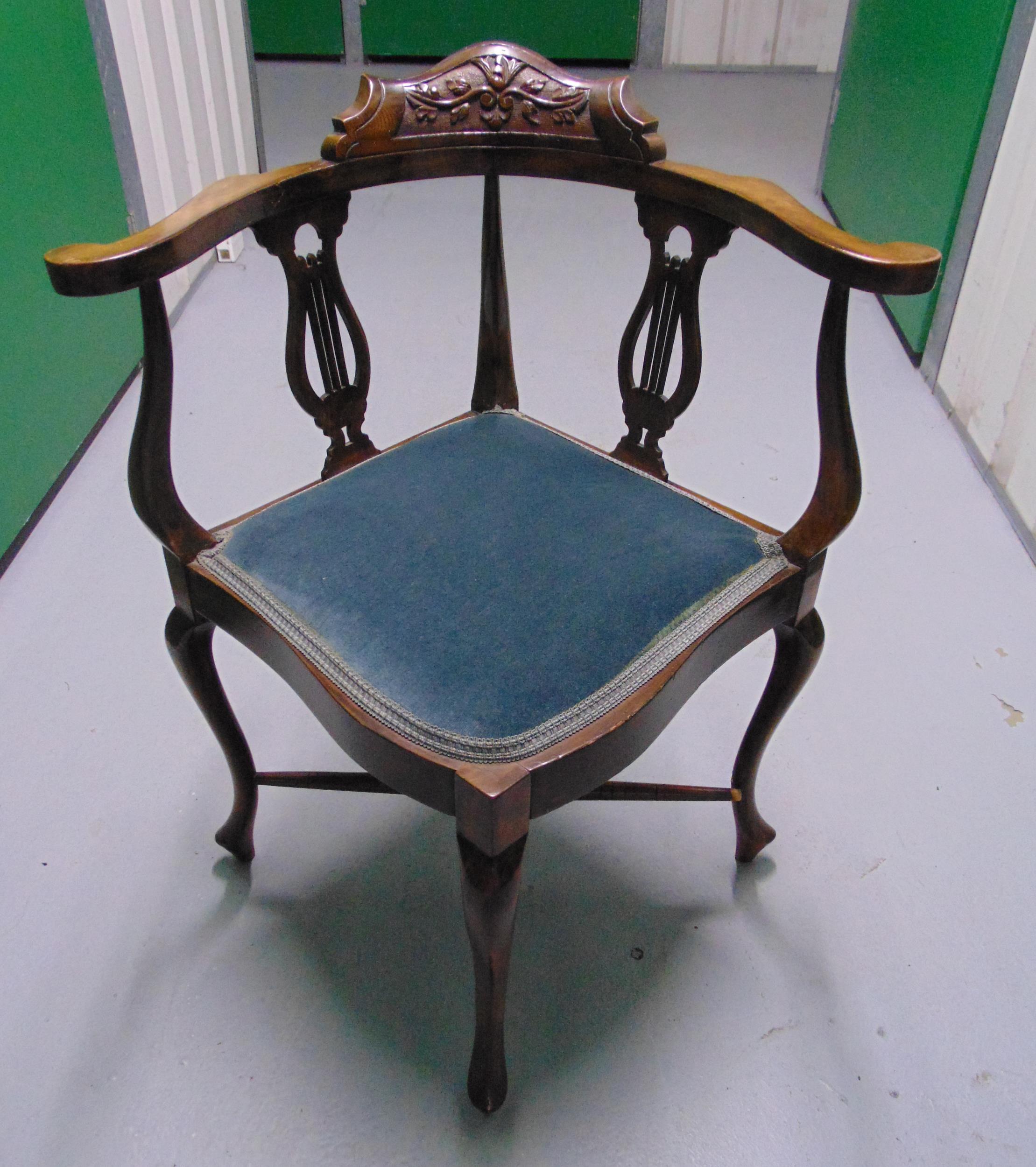 A mahogany upholstered music chair on four cabriole legs