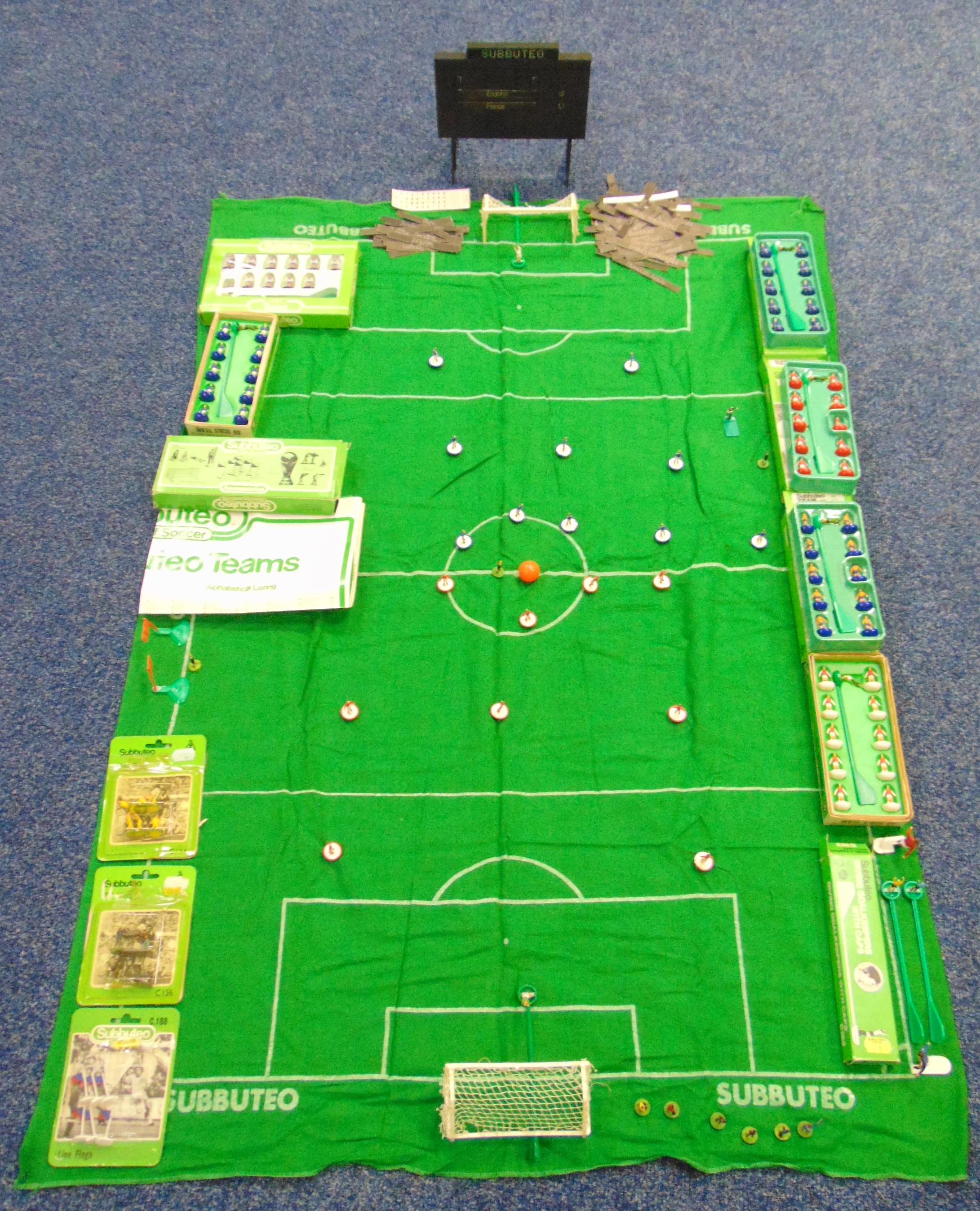 A quantity of Subbuteo table soccer to include teams, goals, a layout and accessories
