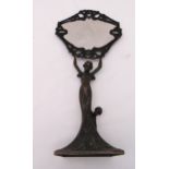 A late 19th century bronze table mirror in the form of a lady with children supporting the oval