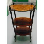 An early 20th century shaped rectangular three tier whatnot with turned supports on four cabriole