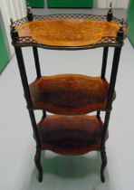 An early 20th century shaped rectangular three tier whatnot with turned supports on four cabriole