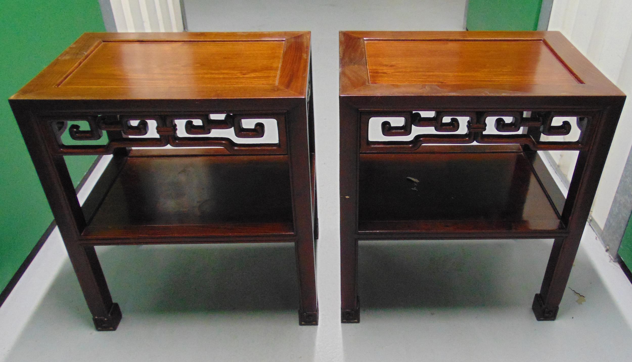 A pair of oriental rectangular mahogany side tables on four rectangular supports, each 56 x 49.5 x