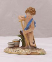 A Meissen figurine of a boy with a spade and buckets, marks to the base, 13cm (h)