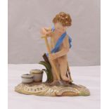 A Meissen figurine of a boy with a spade and buckets, marks to the base, 13cm (h)