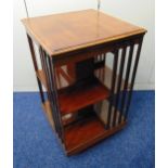 A mahogany rectangular revolving Canterbury with pierced slatted sides, 79 x 45.5 x 46cm