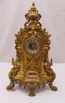 A French late 19th century gilt metal mantle clock, scroll pierced and chased with scrolls and