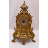 A French late 19th century gilt metal mantle clock, scroll pierced and chased with scrolls and