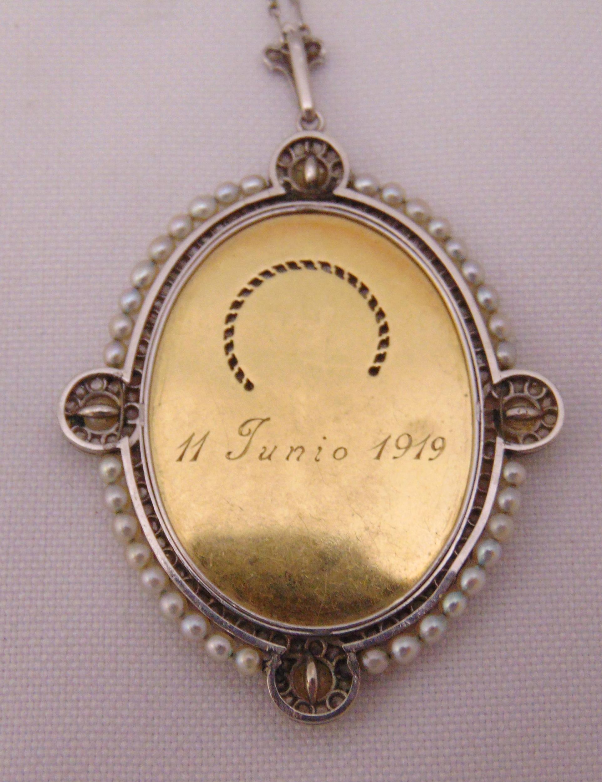 A Madonna pendant set with seed pearls on a platinum chain, signed A Rijis dated 1919 - Image 3 of 3