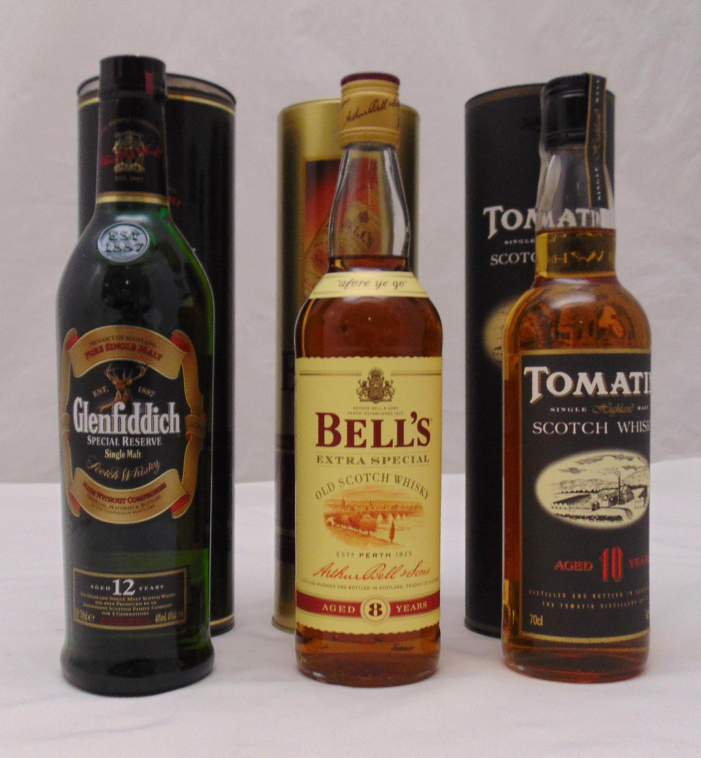 Glenfiddich 12 year old Special Reserve 70cl 40%, Bells 8 year old 70cl 40% tubed and Tomatin 10