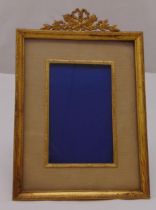 A 19th century French rectangular gilded metal photograph frame with reed and tie border and