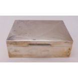 A hallmarked silver rectangular cigarette box, cedar wood lined and hinged cover