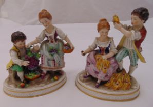 A pair of Sitzendorf figurines of fruit sellers, marks to the bases, 15cm (h)