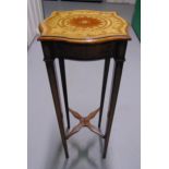 An Edwardian rectangular mahogany plant stand with satinwood inlays on four tapering rectangular