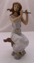 Lladro figurine of a seated siren playing a flute, marks to the base, 35.5cm (h)