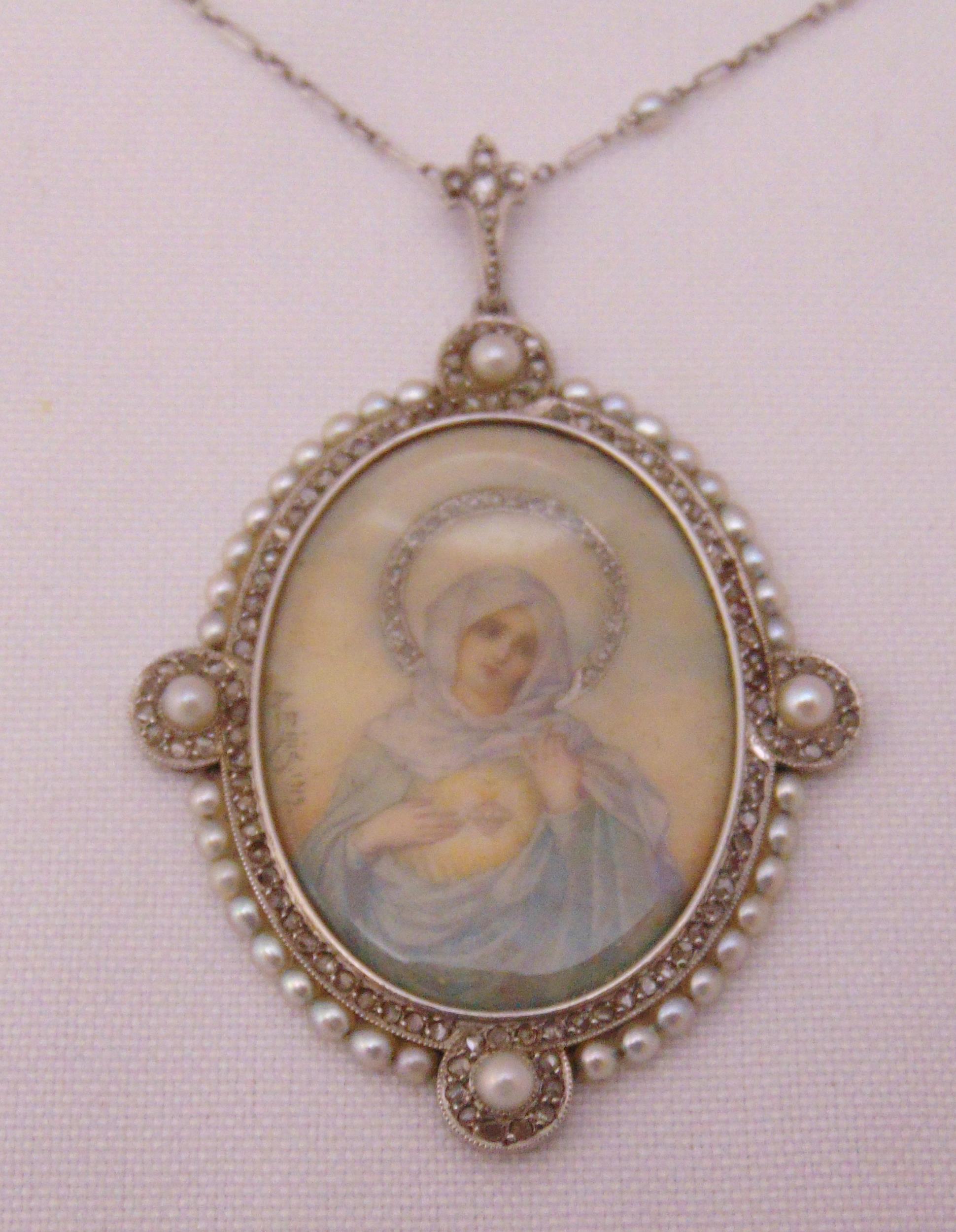 A Madonna pendant set with seed pearls on a platinum chain, signed A Rijis dated 1919 - Image 2 of 3