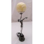 An Art Deco style table lamp in the form of a lady supporting a glass sphere, 68cm (h)