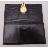Gucci rectangular black leather wallet with 18ct gold clasp and set with a Sovereign