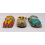 Three vintage litho tin plate toy cars, to include wind up car no 1 learn to drive, friction Taxi no