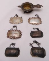 A quantity of hallmarked silver and white metal to include bottle labels (7)