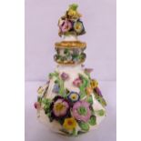 A continental porcelain bottle with drop stopper decorated with applied flowers and leaves,