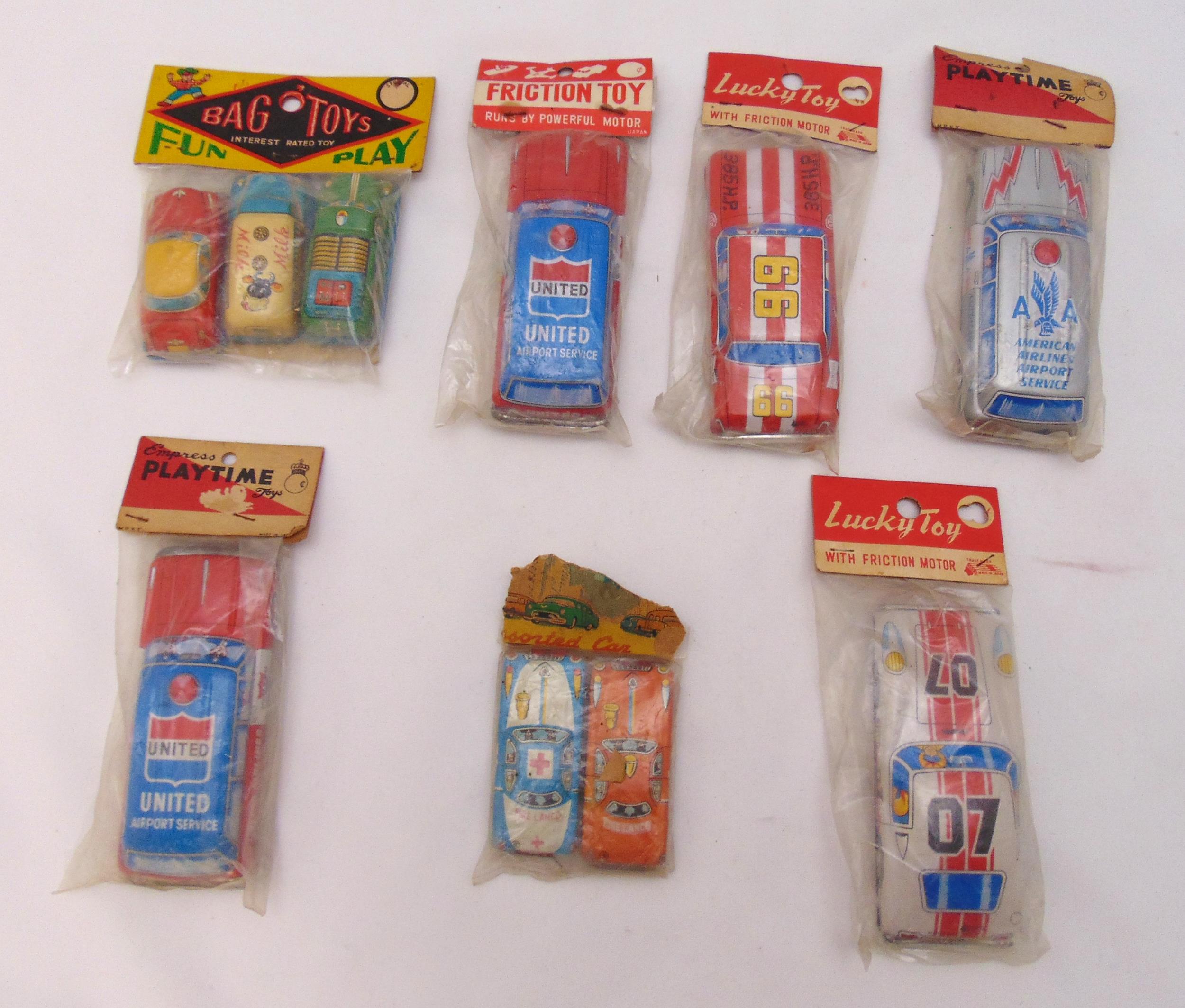 Seven packs of vintage litho tin plate friction cars to include Lucky Toy, Playtime and Bag of