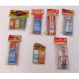 Seven packs of vintage litho tin plate friction cars to include Lucky Toy, Playtime and Bag of
