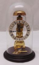 Hermle West German bell-strike pendulum skeleton clock 791-680 in glass dome to include key, 28.