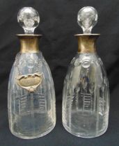 A pair of cut glass and hallmarked silver ovoid decanters with drop stoppers, Birmingham 1949, one