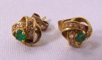 A pair of 9ct yellow gold earrings set with green stones, approx total weight 3.1g