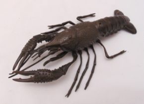 A Japanese Okimono figurine of a lobster with articulated legs, claws and tail, 25 x 14.5cm