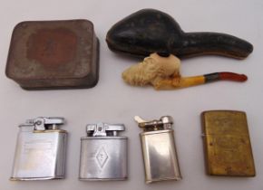 Four cigarette lighters to include Ronson and Zippo, a Meersham pipe in fitted case and a tobacco