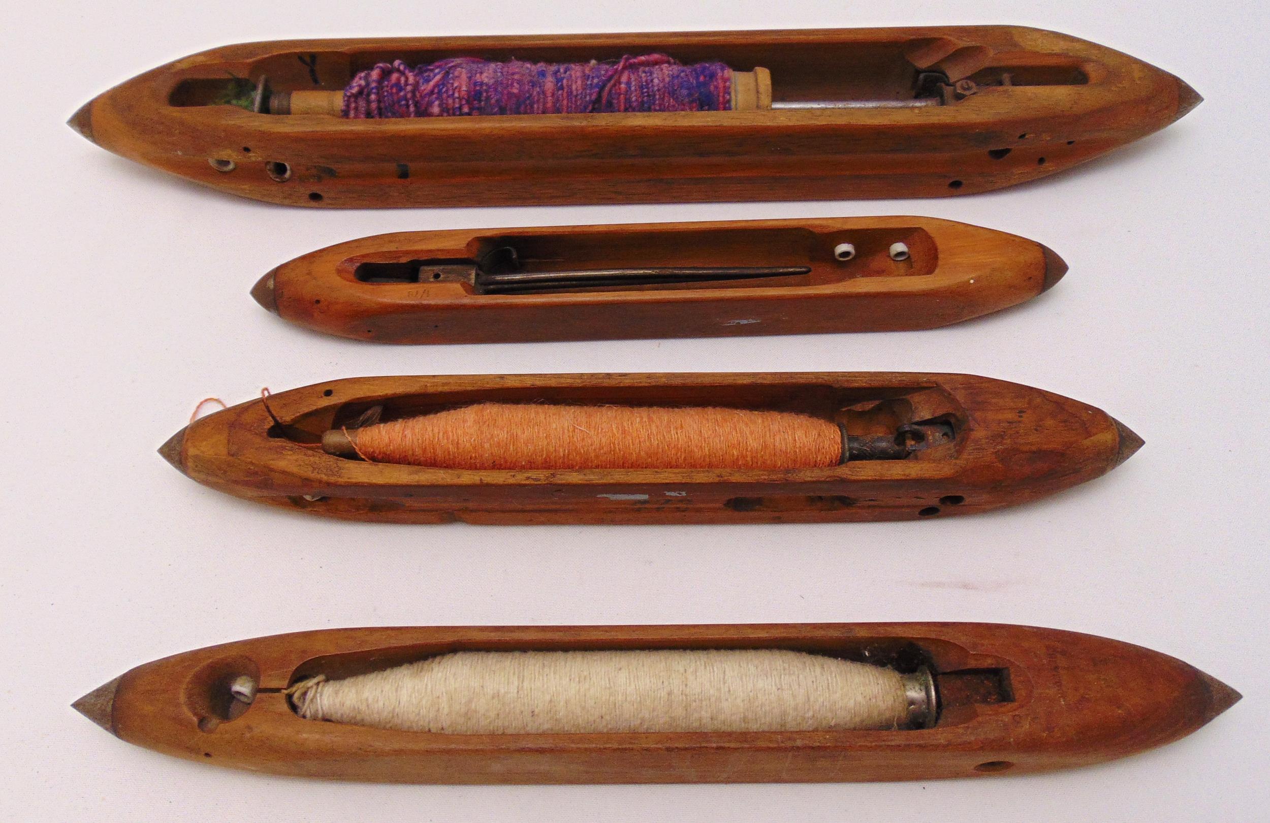 Four wooden antique loom shuttles of customary form