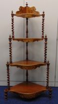 An early 20th century mahogany four tier graduated corner whatnot with barley twist columns and