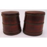 A pair of wooden oval brass bound barrel shaped tea caddies with pull off covers, 13cm (h)